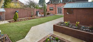 Landscaped garden with shed and raised beds